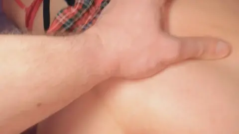 Brunette in doggy style with guy in dim bedroom POV
